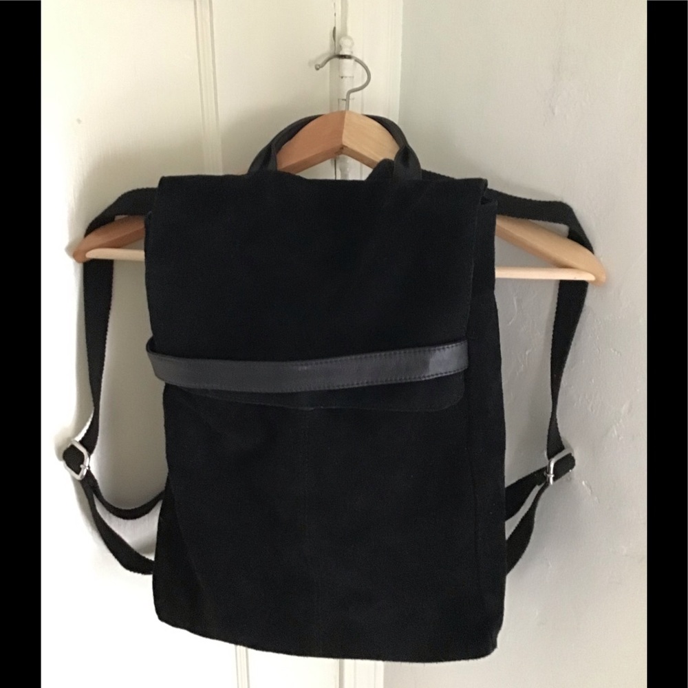 Black suede and leather back and straps are leather